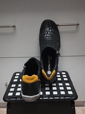 Remonte Black Slip-On Shoes with Yellow Heel Collar